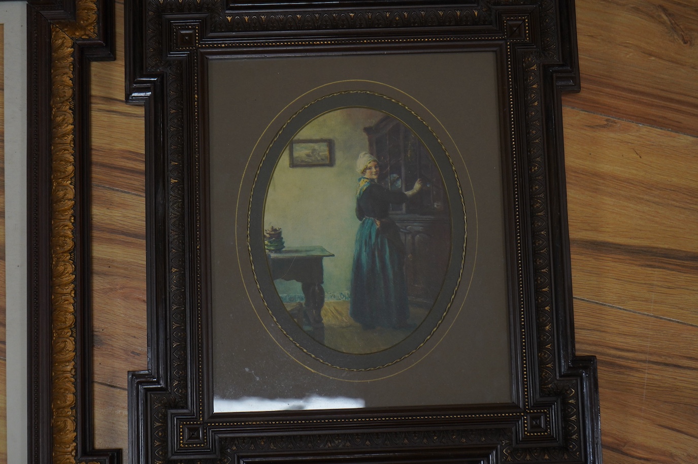 Two decorative partially gilt French picture frames, one housing a colour print, largest overall 58 x 49cm. Condition - good